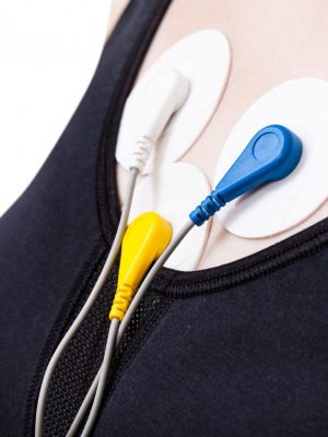 side view of electrodes of Holter monitoring of electrocardiogram on chest isolated on white background